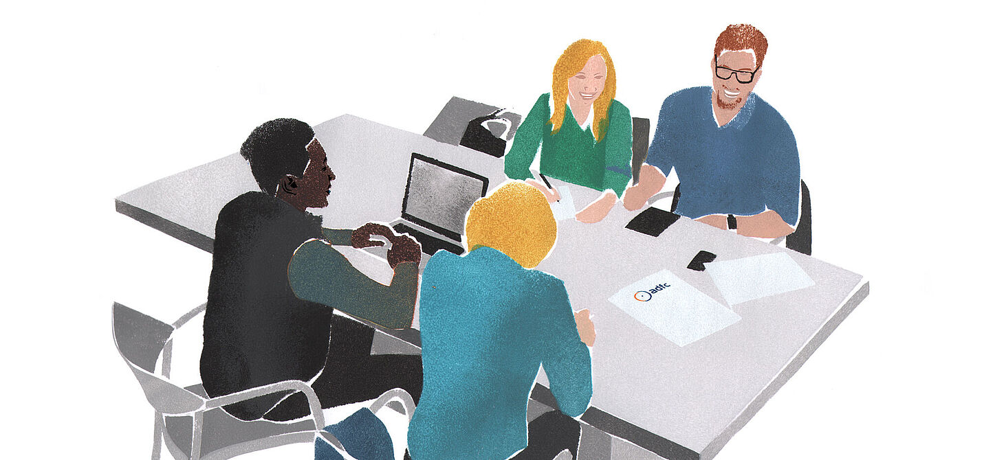 Menschen sitzen um einen Tisch und planen etwas (Grafik, kein Foto).